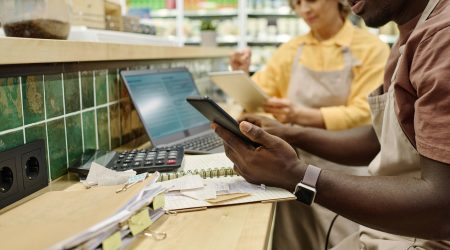 Colleagues controlling the sale of goods